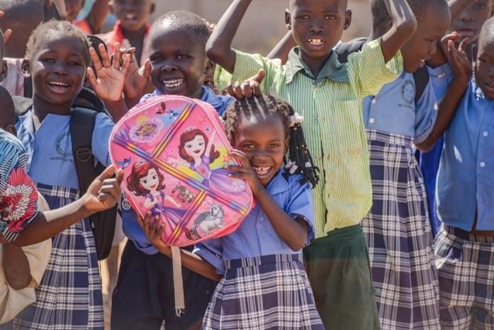 Children with school backpacks